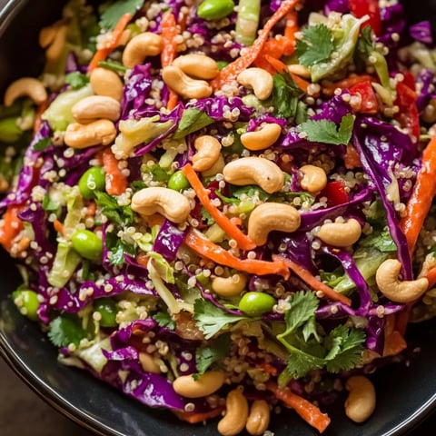 A bowl of food with nuts and vegetables.