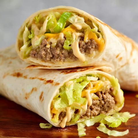 Two Big Mac Wraps are shown, filled with lettuce, cheese, and meat.
