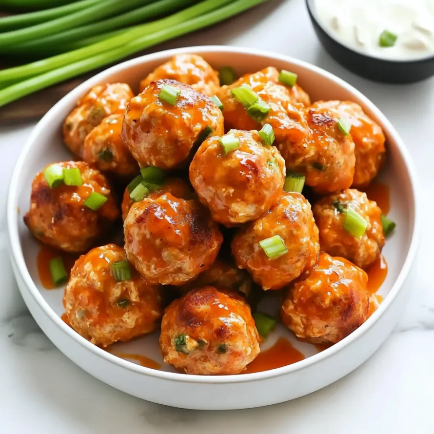 A bowl of meatballs with sauce.