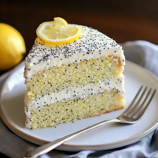 A slice of cake with a lemon wedge on top.