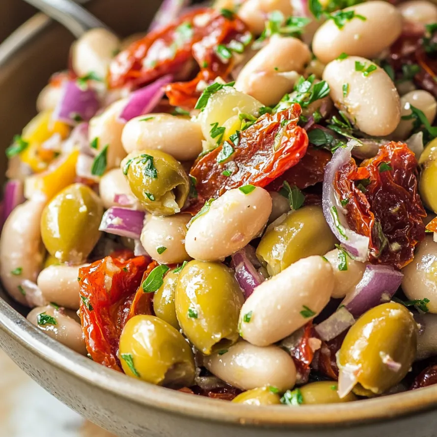 A bowl of food with olives, beans, tomatoes, and peppers.