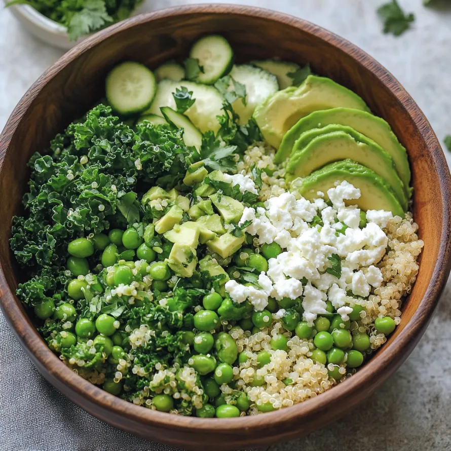 A bowl of food with avocado, cucumber, and peas.