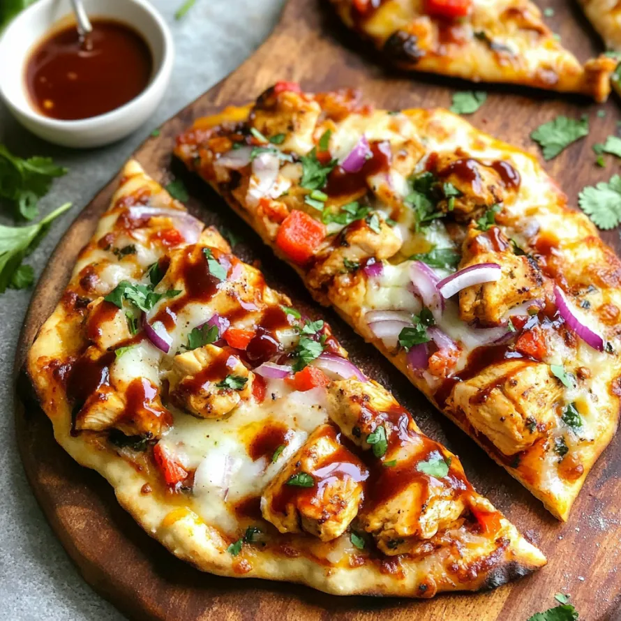 A pizza with sauce and vegetables on a wooden cutting board.
