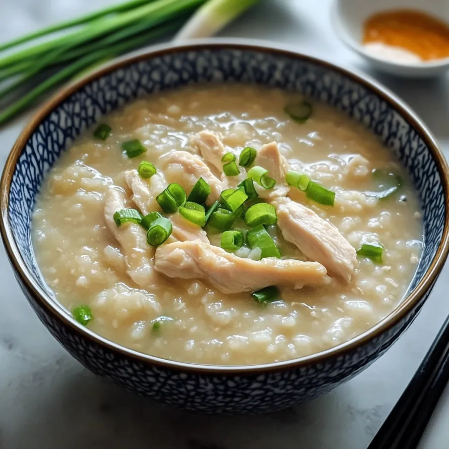 A bowl of soup with chicken and green onions.