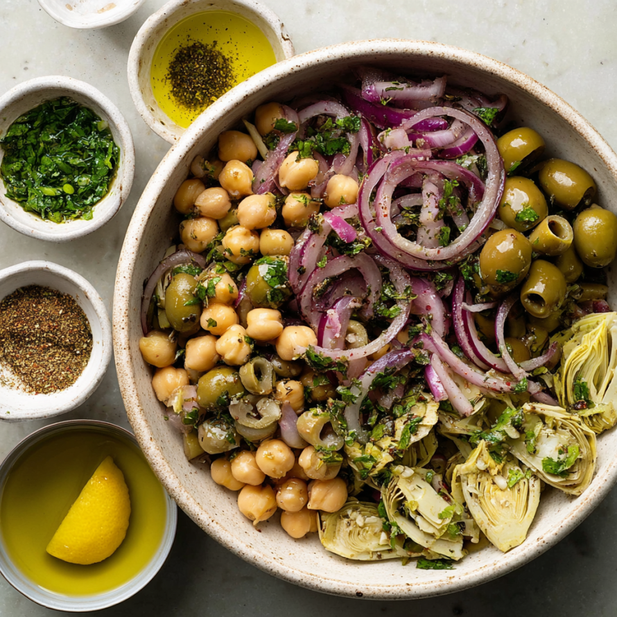 A bowl of Marinated Za'atar Bean Salad is displayed on a table.