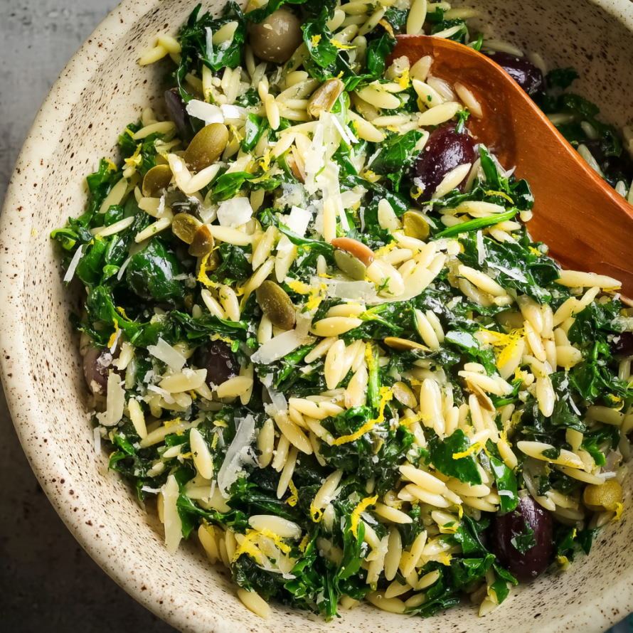A bowl of Orzo Kale Salad with Lemon Vinaigrette.