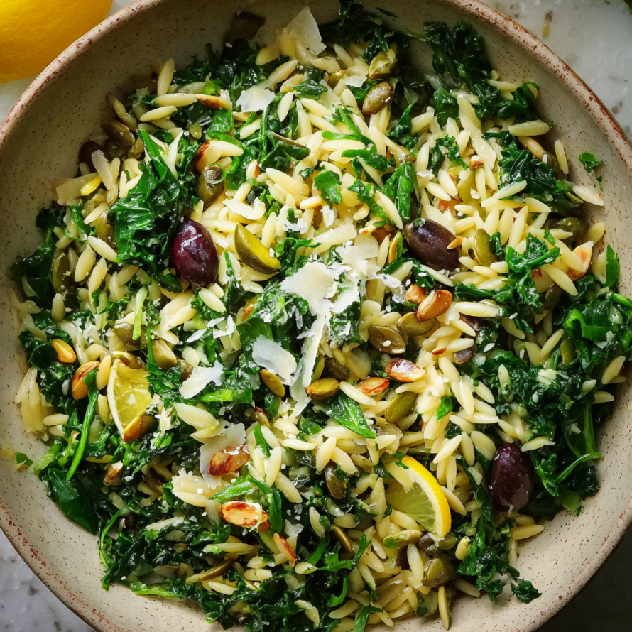 A bowl of Orzo Kale Salad with Lemon Vinaigrette.
