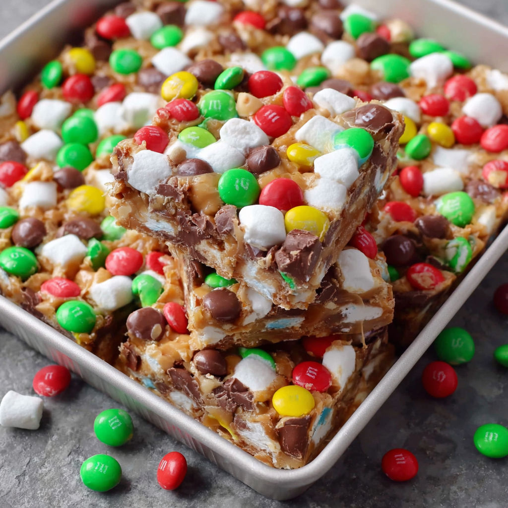 A close up of a candy bar with M&M's and chocolate.