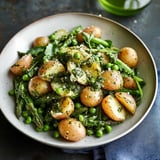 A plate of food with potatoes, peas, and greens.