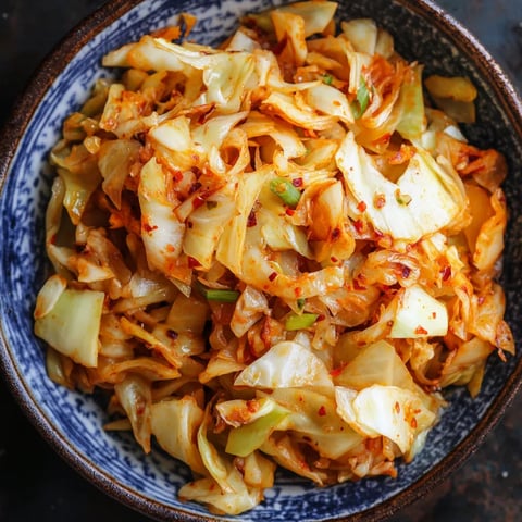 A bowl of food with a green vegetable in it.