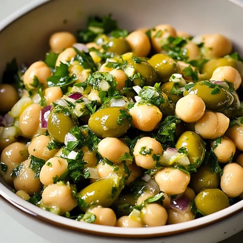 A bowl of food with green beans and chickpeas.