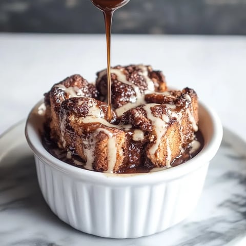 A bowl of food with a spoon in it.