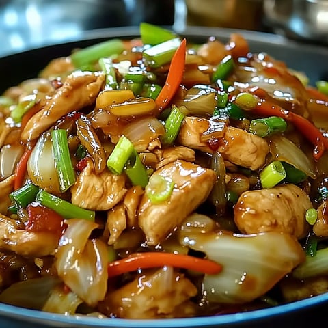A delicious Chinese Chicken Cabbage Stir-Fry is served in a bowl.