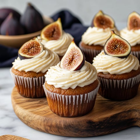 A plate of Fig Cupcakes with Honey Cream Cheese Frosting.