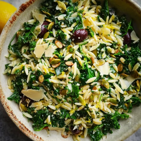 A bowl of Orzo Kale Salad with Lemon Vinaigrette.