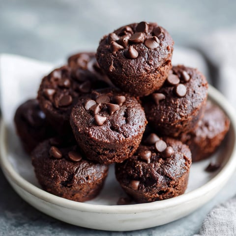 A stack of protein brownie bites in a bowl.