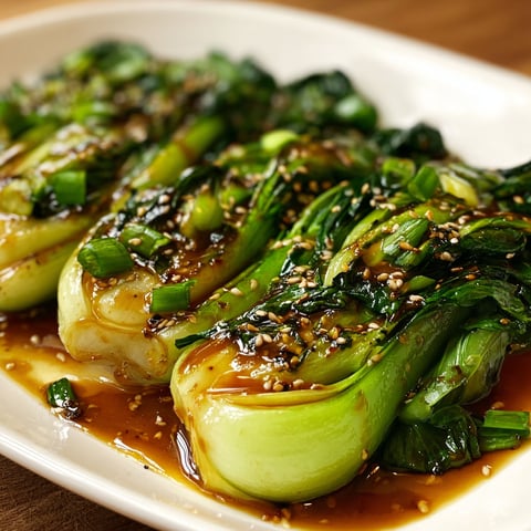 A plate of bok choy with garlic sauce, ready to be enjoyed.