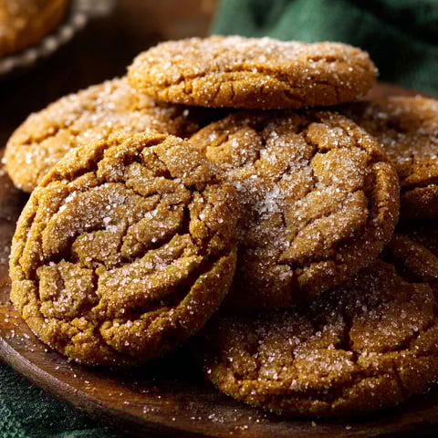 A plate of Maple Pumpkin Cookies with sugar sprinkled on top.