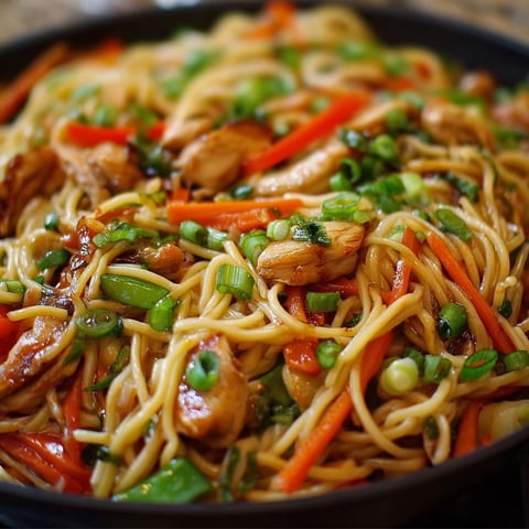 A delicious Chicken Lo Mein dish with a variety of vegetables and noodles.