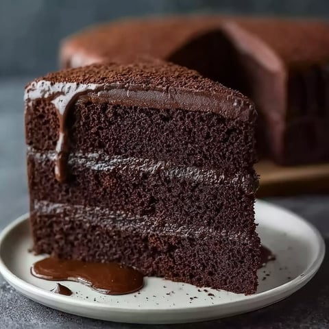 A slice of Matilda Chocolate Cake on a plate.