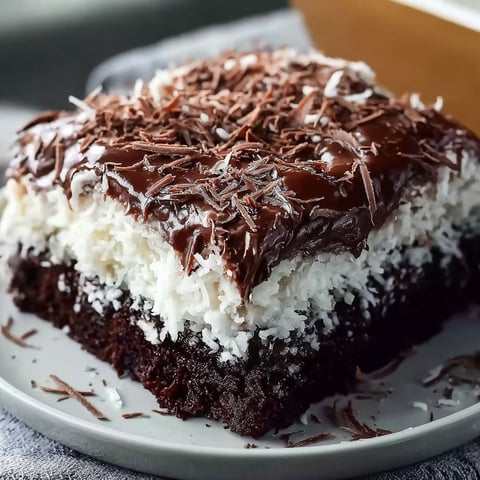 A slice of Choco Coconut Dream Cake on a plate.