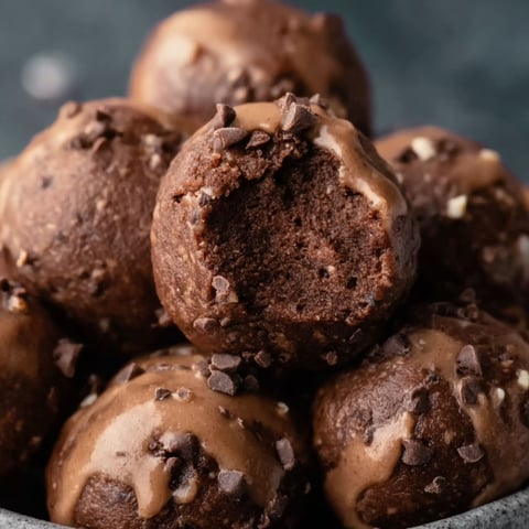 A bowl filled with delicious chocolate protein bites.