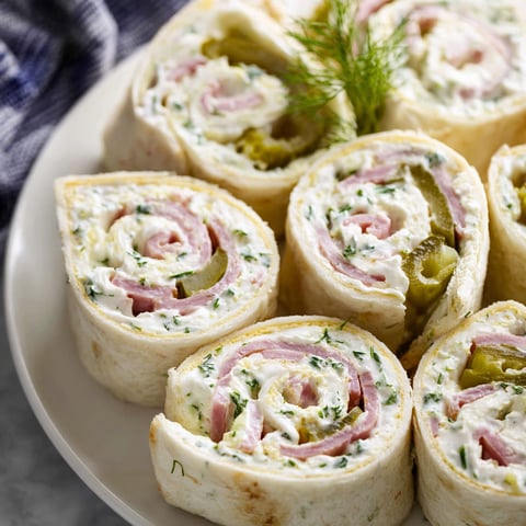 A plate of dill pickle pinwheels, a delicious appetizer.